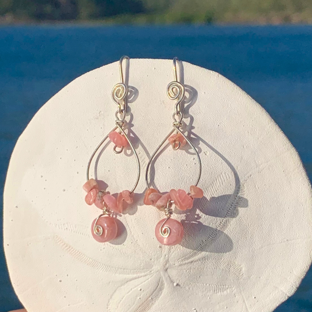 Ray of Sunshine Jewellery - stunning pink Rhodochriste gemstones wrapped in Sterling Silver and hanging from a sand dollar shell.