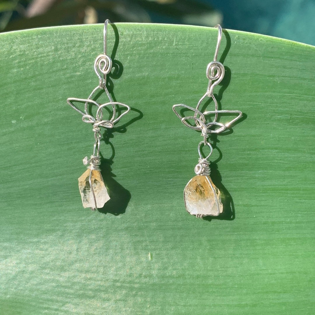 Ray of Sunshine Jewellery- Sterling Silver earrings with golden Citrine gemstones on a green agave leaf in the sunshine.