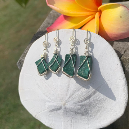 Ray of Sunshine Jewellery- 2 sets of Green earrings on a white shell with a colorful flower in the background