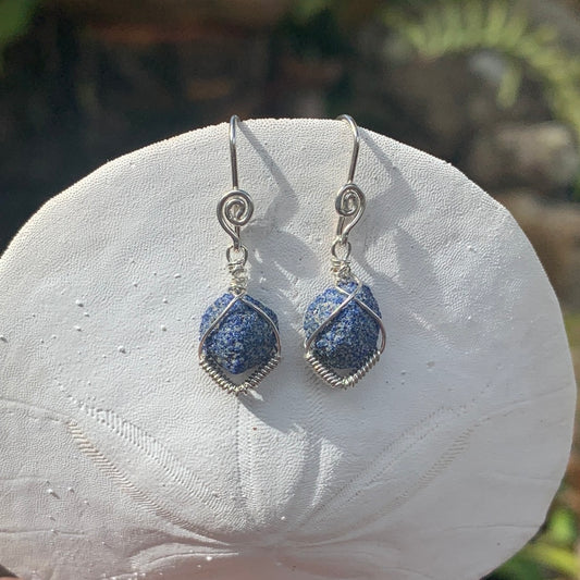 RAY OF SUNHSINE JEWELLERY- these gorgeous blue yet rough stone earrings looks stunning in the sunshine as they hang from a white sand dollar shell.