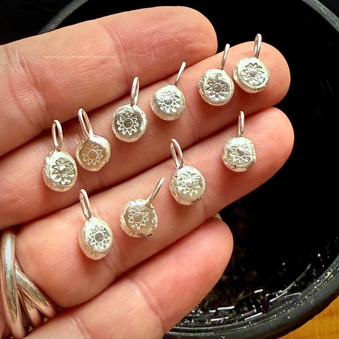 Ray of Sunshine Jewellery - a handful of silver dollops in the palm of my hand