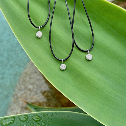 Ray of Sunshine Jewellery - 3 dollops of sunshine necklaces sitting on a large green leaf
