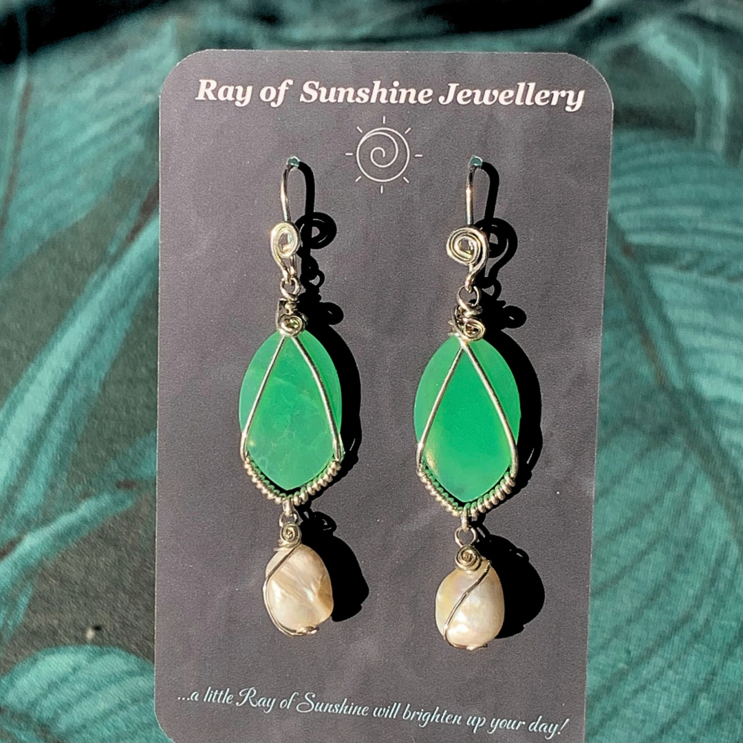 Ray of Sunshine Jewellery-Apple Green Chrysoprase  teardrop earrings with pearl drops on a 'Ray of Sunshine Jewellery' card against a green leafy background.