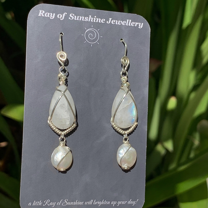 Pair of moonstone and pearl earrings on a 'Ray of Sunshine Jewellery' card with a natural background