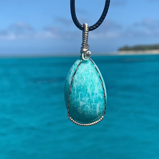 Ray of Sunshine Jewellery- this gorgeous necklace is hanging over the stunning turquoise waters of Lady Musgrave Island