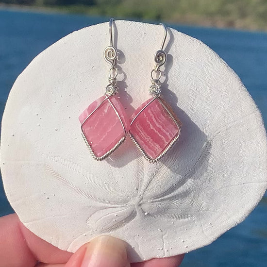 Ray of Sunshine Jewellery - stunning pink gemstones hand carved by me wrapped in Sterling Silver and hanging from a sand dollar shell