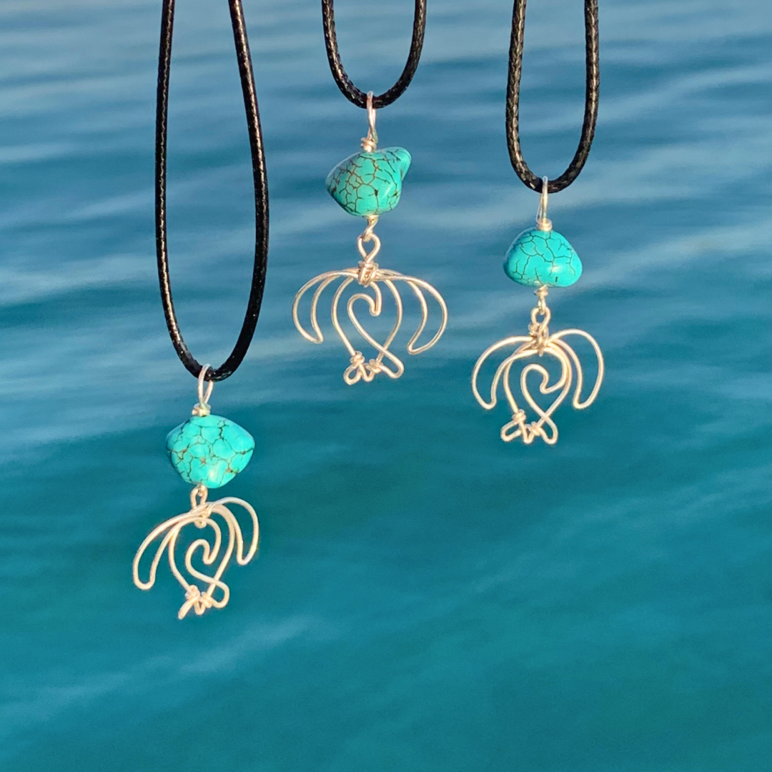 Ray of Sunshine Jewellery - hand forged in Sterling Silver these gorgeous Turquoise coloured stones are the same colour as the stunning clear water they are overhanging in the sunlight. Truly Stunning